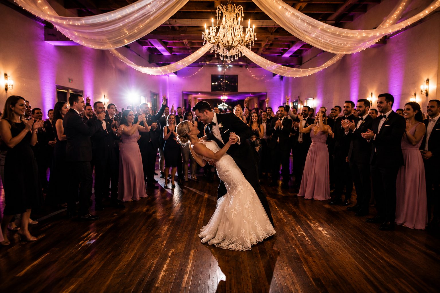 Reception room set with tables and dance floor lighting before guests arrive